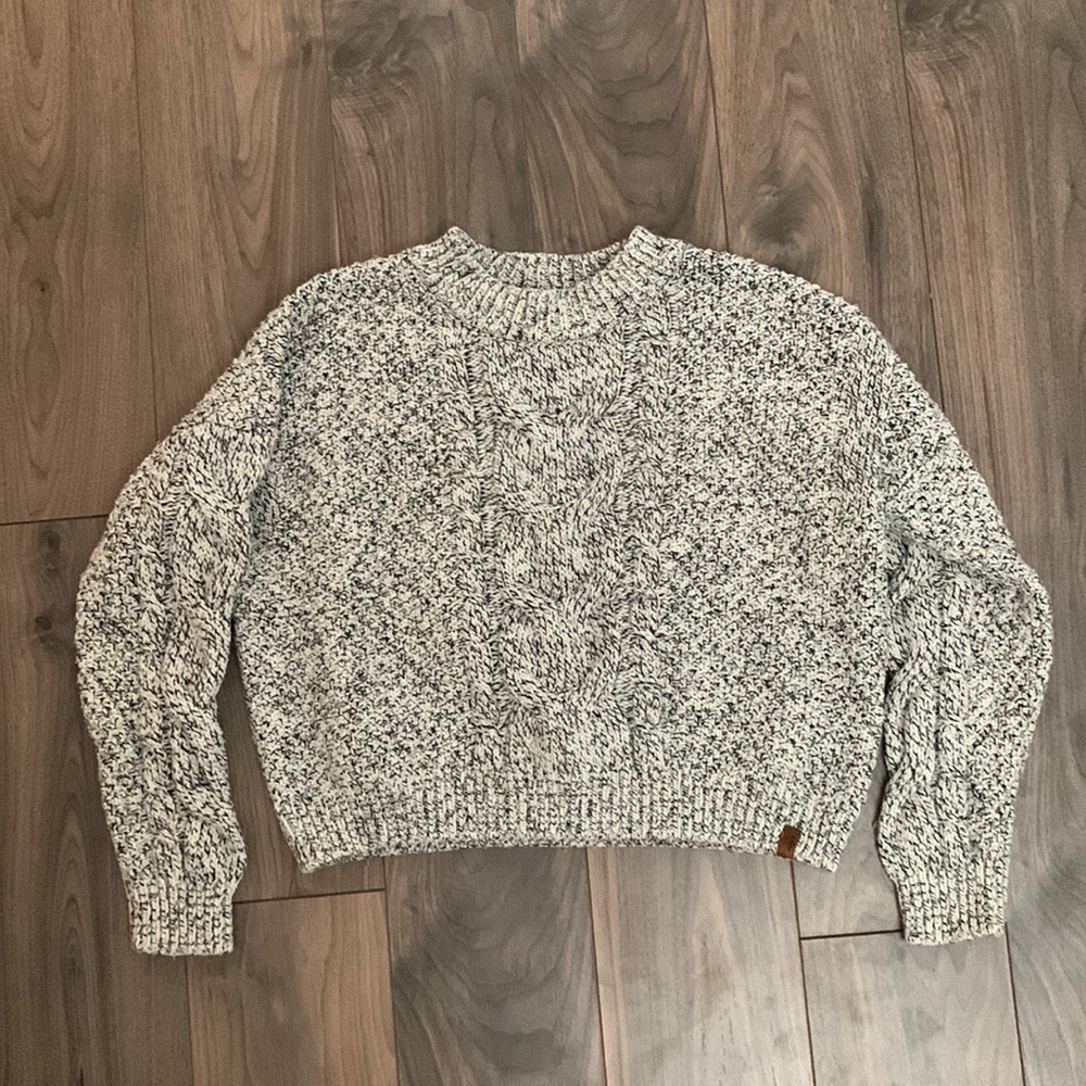 Roots, black, and white knit sweater